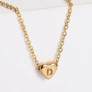 Detailed macro view of 18K gold plated heart pendant necklace with engraved letter D
