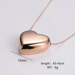 Macro shot of polished rose gold heart pendant necklace with 15mm 3D heart and snake chain