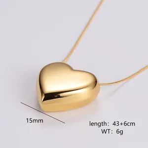 Macro view of golden 3D puffy heart pendant with snake chain measurements 15mm 43+6cm