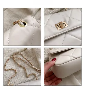 Detail view of cream quilted bag with golden twist lock and chain strap hardware