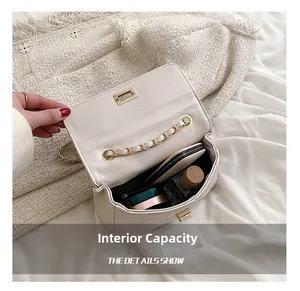 Internal capacity of the quilted chain bag showing space for makeup and perfume
