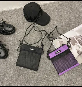 Flat lay of nylon shoulder bags with mesh pocket and adjustable thin strap detail
