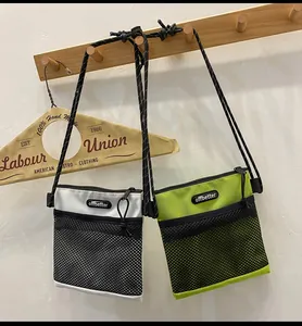 Detail of nylon crossbody mini bags with mesh pockets and adjustable rope straps