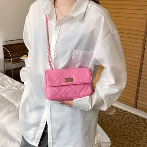Stylish pink quilted chain shoulder bag featuring a golden twist lock closure for women