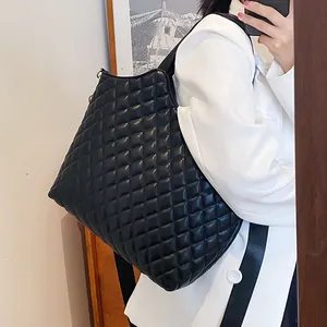 French style black quilted leather tote bag for women showing a spacious shoulder design