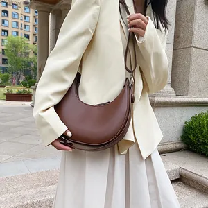 Chic dark brown half-moon shoulder bag in smooth faux leather for women's fashion