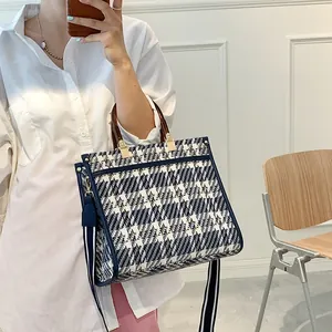 Classic blue and white check canvas tote bag with resin handles and wide shoulder strap