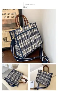 Detail view of blue tweed tote bag with amber handles and striped wide strap