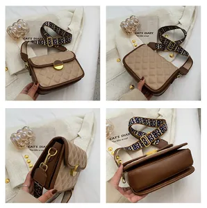 Detailed views of beige quilted crossbody bag with gold lock and patterned strap