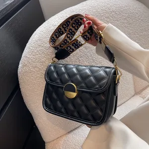Modern black quilted crossbody bag with gold buckle and jacquard letter strap for women