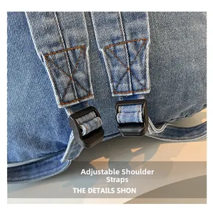 Detailed shot of adjustable denim backpack straps with contrast orange stitching