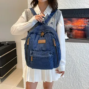 Large capacity dark blue denim backpack with leather patch for travel and school