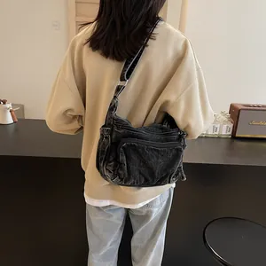 Retro washed denim messenger bag for women with multi-pocket design and adjustable strap