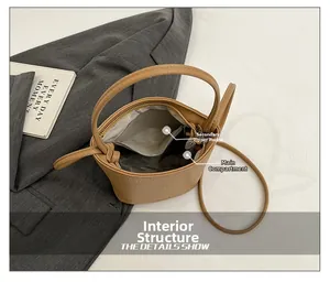 Internal view of litchi texture bucket bag with zipper pocket and main compartment