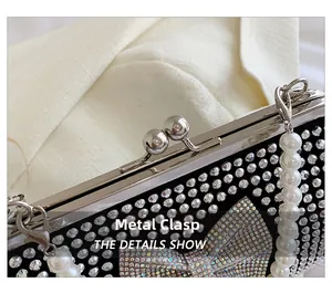 Detail shot of the metal hardware clasp, sparkling rhinestones and white pearl strap