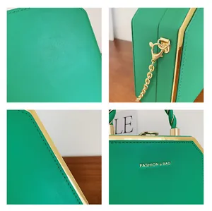 Detail of green acrylic box bag showing textured leather, gold metal edges and chain