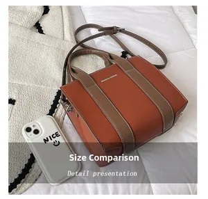 Brown tote bag size comparison with smartphone showing large capacity and lychee texture
