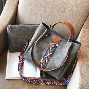 Grey suede tote and inner bag set with ethnic woven strap and brown handles