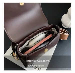 Detail showing the internal capacity and fabric lining of this vintage dark brown bag