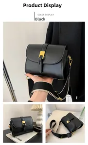 Detail of black leather vintage crossbody bag featuring golden buckle and woven wide strap