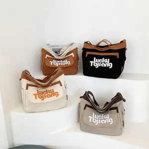 Grandi borse tote in tela minimaliste con stampa Lucky Tbjiang in quattro colori neutri