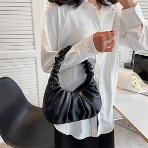 Minimalist black pleated cloud bag with soft faux leather for stylish office commuting