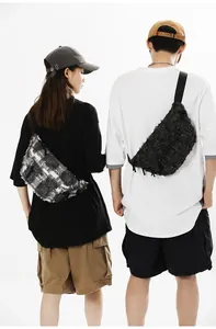 Close-up of canvas chest bags with fringe edges on male and female models