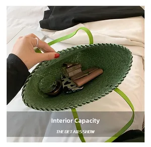 Macro view of green woven tote bag showing internal capacity with various daily items