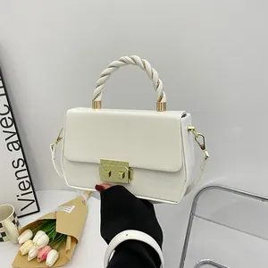Minimalist white PU leather crossbody handbag with braided handle and gold metal lock