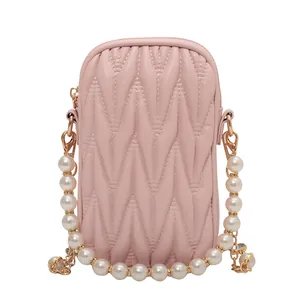 Pink quilted leather mini crossbody phone bag with elegant pearl and gold chain strap