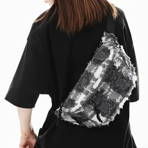 Street style oversized black and white plaid crossbody bag with frayed edge texture