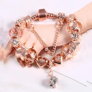 Roségouden DIY-bedelarmband met hartjeshangers en roze kristallen kralen voor dames