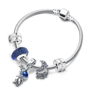 Silver snake chain charm bracelet featuring astronaut and blue galaxy starry moon pendants