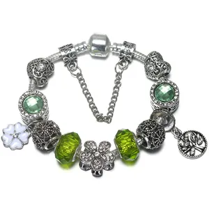 DIY charm bracelet with green murano glass beads and tree of life pendant on snake chain