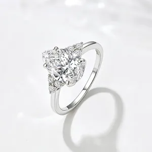 Elegant S925 sterling silver pear-cut zircon ring with shimmering accent side stones