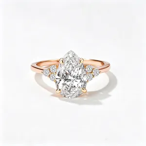Detailed view of pear-cut zircon ring in rose gold finish with side accent stones