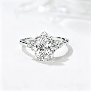 Macro detail of pear-cut high-clarity zircon ring with six-prong silver setting