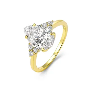 Elegant S925 sterling silver gold-plated pear cut zircon ring with side accent stones