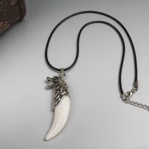 Punk style silver wolf head necklace with resin fang pendant on black leather cord