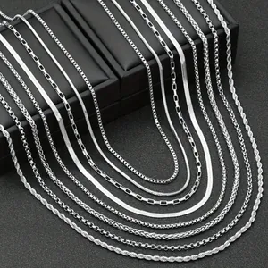 Variety of silver stainless steel necklaces featuring twisted, snake, and curb link chains