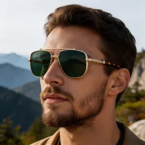 Detail of vintage square sunglasses with gold metal frame and dark green lenses for men