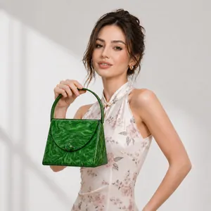 Elegant emerald green marble textured acrylic handbag with round handle and metal clasp