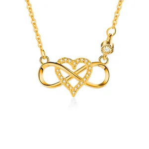 Detail of s925 silver infinity heart necklace with sparkling zircon pavé in gold finish
