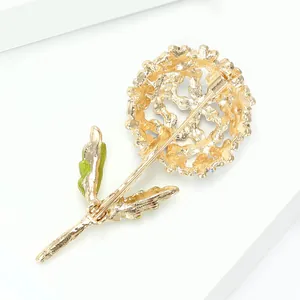 Golden hydrangea flower brooch with green enamel leaves and secure pin clasp on back