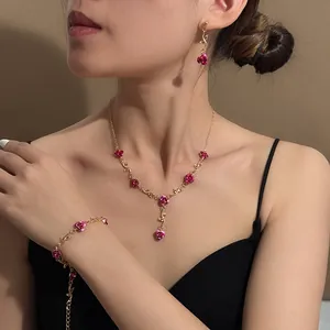 French vintage rose jewelry set including necklace bracelet and earrings on model