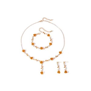 Detailed view of French vintage rose jewelry set including necklace bracelet and earrings