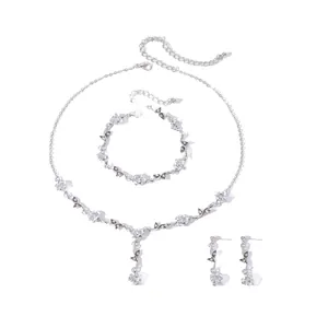 Exquisite detailed view of silver rose jewelry set including necklace and earrings