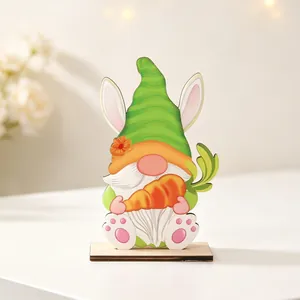 Detailed view of wooden Easter gnome with bunny ears and a carrot on a round base