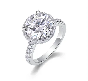 Macro shot of S925 sterling silver ring featuring a halo-set moissanite and pavé band