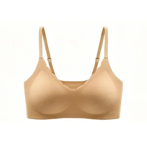 Detail of scalloped edges and adjustable thin straps on a seamless nude bra